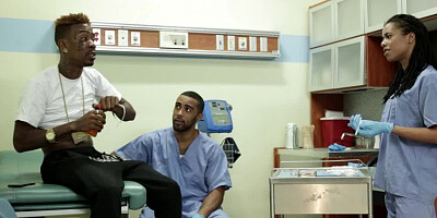 A couple of chicks are doing a threesome with a dude in the living room