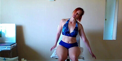 Redheaded MILF enjoy in some yoga in front of the cam