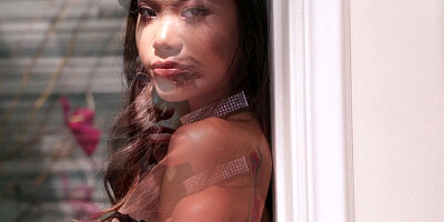 Asian girl in fishnet stockings adores getting her pussy pounded by a white cock