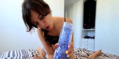 Amazing brunette is using flashlight toy to stimulate her man