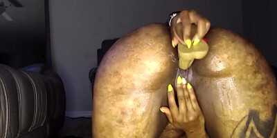 Chubby black mom rams her creamy pussy with a dildo on webcam