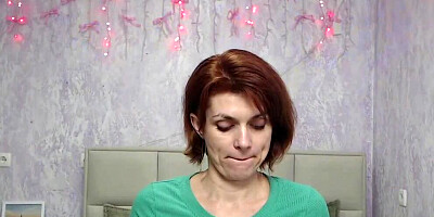 Redhead Milf plays with balloon on webcam