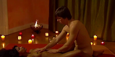 Nude and oiled up brunette gets a full body massage