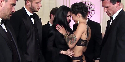 Two naughty girls are blow-banged and bukkaked by a lot of guys