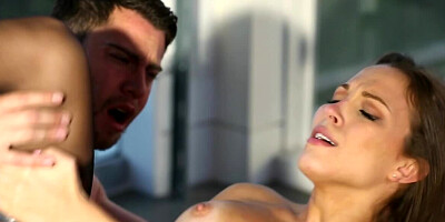 Big breasted brunette is getting fucked on the roof