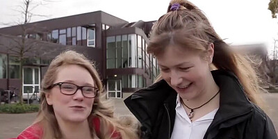 Two nerdy female students are experimenting with their sexual orientation