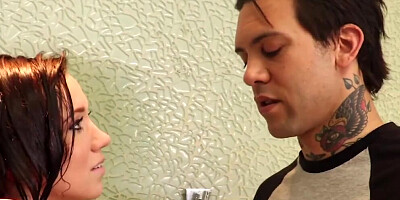 Bailey Brooke is being fucked by a tattooed man under the shower