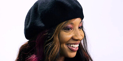 Attractive black babe spreads legs and plays with wet pussy