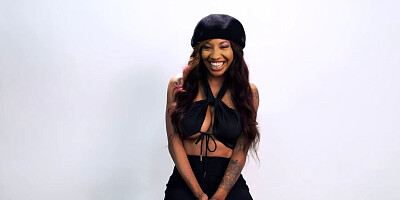 Attractive black babe spreads legs and plays with wet pussy