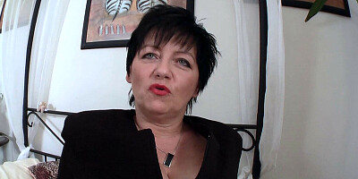 Short-haired mature woman plays with that wet hairy pussy