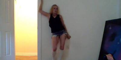 Amateur blonde performs a striptease before toying her bald snatch