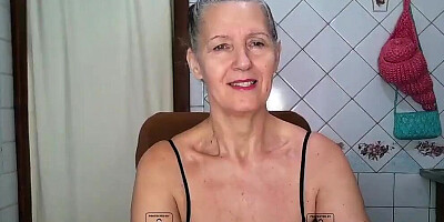 Solo granny is touching her body and rubbing pussy while posing in sexy lingerie