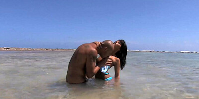 Tanned black hair beauty in a steamy beach sex with her lover