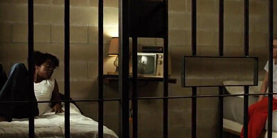 Two female prisoners are enjoying sensual lesbian oral sex in a jail cell