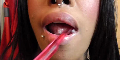 Lovely Latina is brushing her teeth in front of the camera