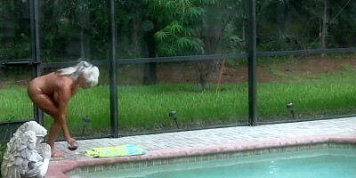 Mature blonde with giant boobs is sucking and fucking a BBC