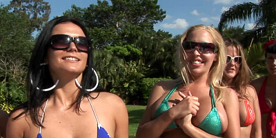 Two people are fooling around outdoors in the garden