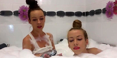 Lesbian sex play between two dykes while they are taking a bath