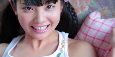 Asian teen girl with pigtails is showing her perfect natural curves