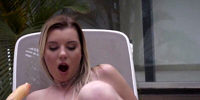Solo blonde with big boobs is using a big dildo for masturbation