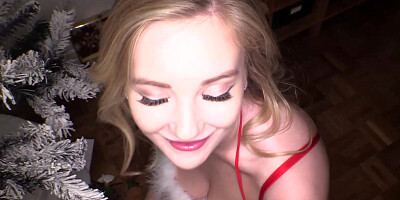 Gorgeous blonde in red Santa lingerie flaunts with her huge tits and poses