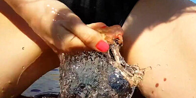 Close-up on a slimy pussy while it's being rubbed outdoors