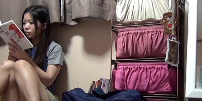 Spycam catches a Japanese schoolgirl rubbing her hairy muff