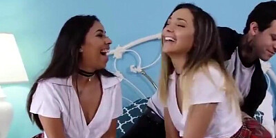 Tattooed stallion takes care of two hot schoolgirls and their aching pussies