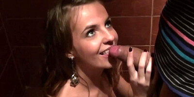 Slender amateur sucks two dicks for cash in the public toilet