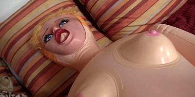 She catches him playing with a sex toy and offers a blowjob