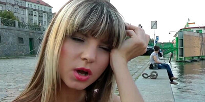 A chick with tiny nipples is getting naked while out in public