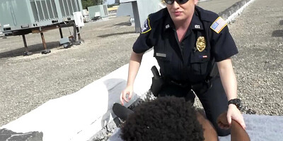 Black stud and two female cops are fucking on the roof