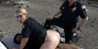 Black stud and two female cops are fucking on the roof